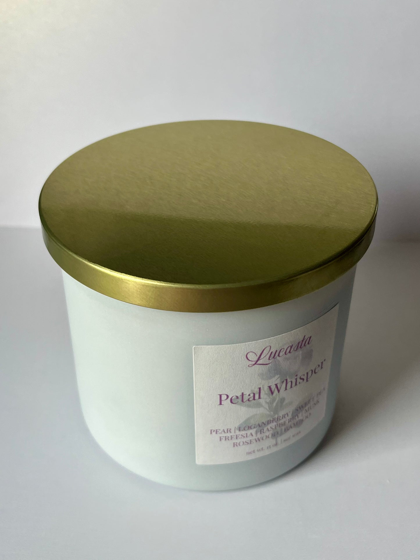 Lucasta Petal Whisper soy candle with gold lid, clean side profile on white background