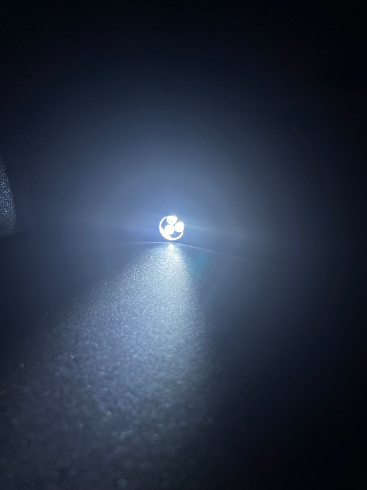 Lucasta Mini Flashlight Keychain turned on, front view showing light output