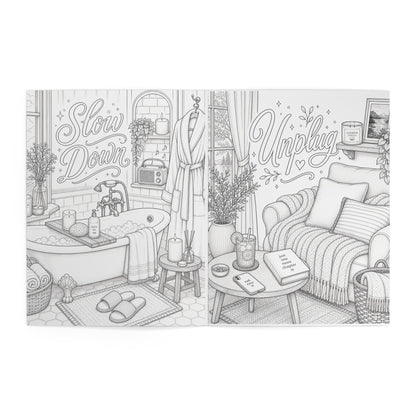 Lucasta Unwind coloring book interior page showing cozy living room scene with 'Slow Down' and 'Unplug' text