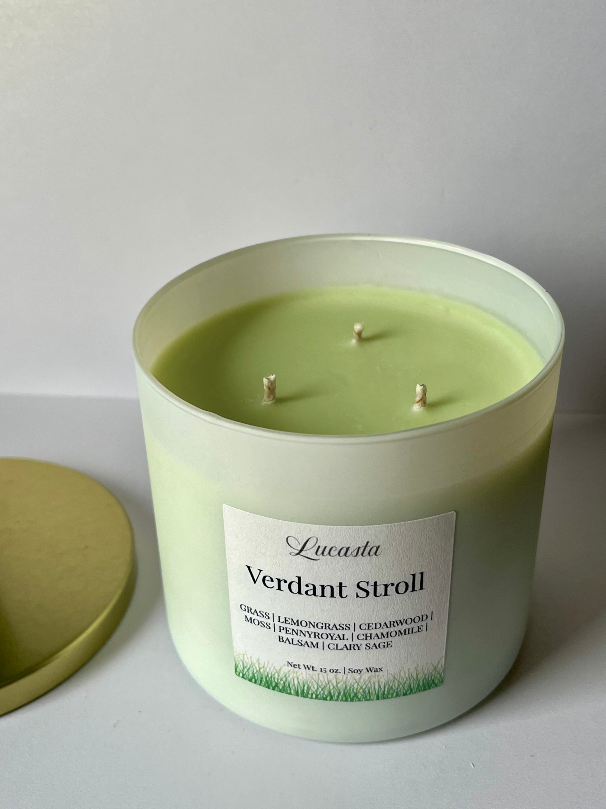 Green candle with 'Verdant Stroll' label on a white background