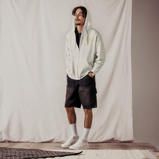 man wearing Cream hoodie with Lucasta botanical logo on front