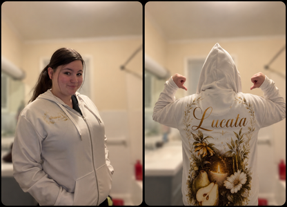 Person wearing Lucasta Botanical Zip Hoodie in cream showing floral design, lifestyle shot