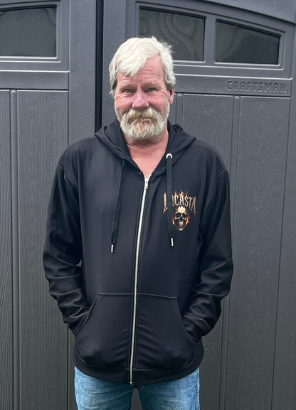 Man wearing Lucasta Inferno Zip Hoodie, front lifestyle shot showing skull design