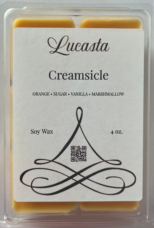 Lucasta Creamsicle soy wax packaging with label and swirled design.