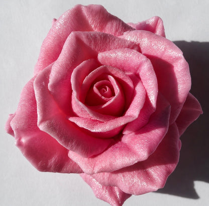 Pink beeswax rose wax melt with a shimmery pearlescent finish, full bloom detail