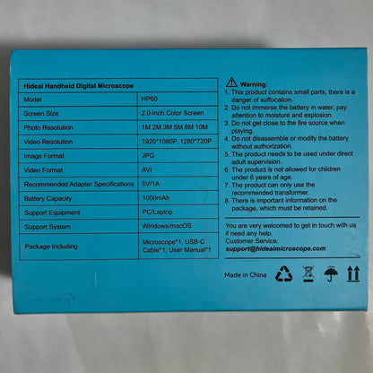 The back of a bright blue product box showing printed specifications and warnings for a HIDE handheld digital microscope, including model HP190, screen size, resolution, battery capacity, and package contents.