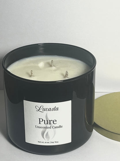 Lucasta Pure unscented 3-wick soy candle in black jar showing wax surface, top-down view