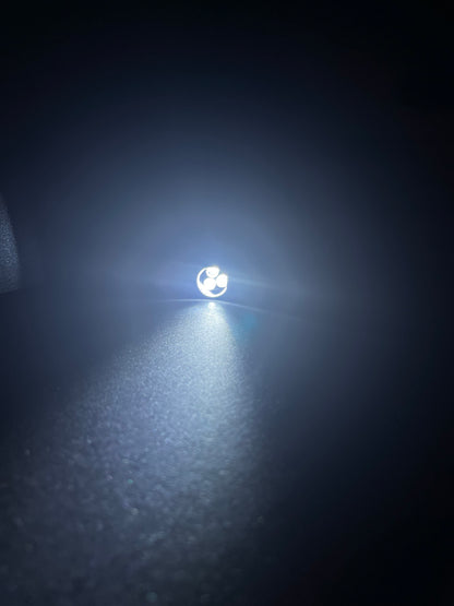 Lucasta Mini Flashlight Keychain turned on, front view showing light output