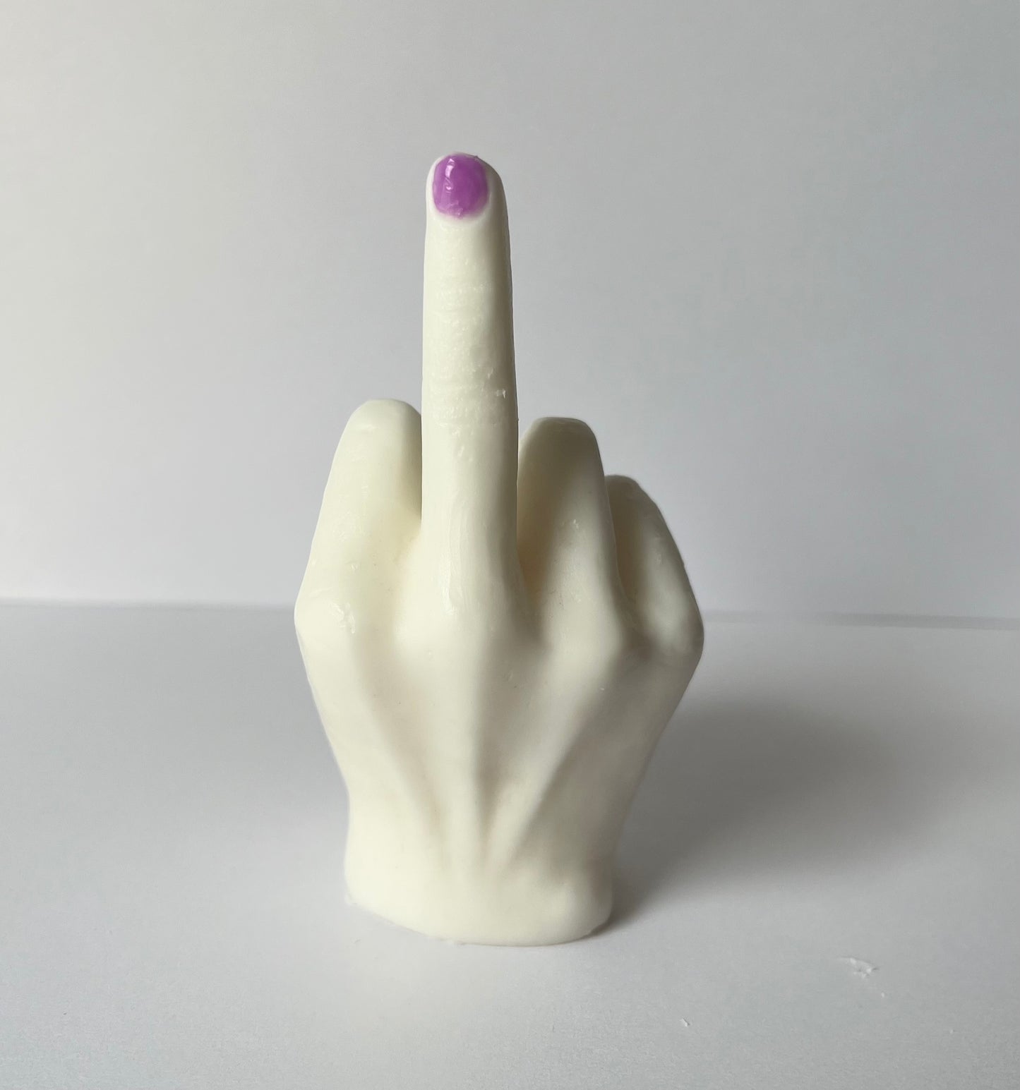 Lucasta middle finger wax melt with purple nail detail, single product view on white background