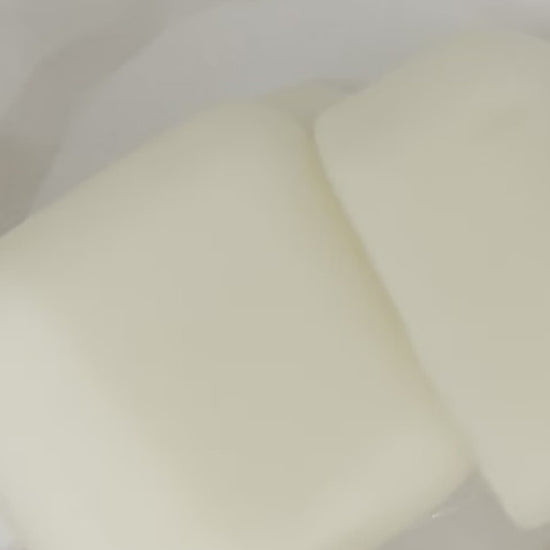 Lucasta Silk Melts massage cubes in use, demonstrating application and texture on skin