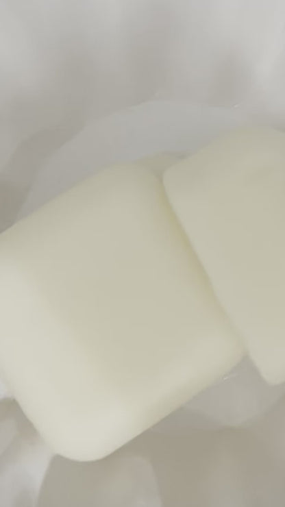 Lucasta Silk Melts massage cubes in use, demonstrating application and texture on skin